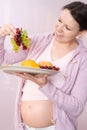 Smiling pregnant woman standing Royalty Free Stock Photo