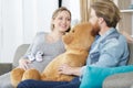 Smiling pregnant woman and husband with teddy bear Royalty Free Stock Photo