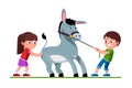 Boy pulling donkey on reins and girl pushing it Royalty Free Stock Photo