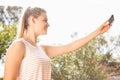 Smiling pretty blonde taking selfies