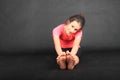 Smiling girl exercising yoga - seated forward fold Royalty Free Stock Photo