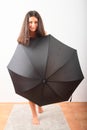 Smiling pretty girl behind black umbrella Royalty Free Stock Photo