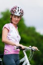 Smiling pretty girl - cyclist Royalty Free Stock Photo