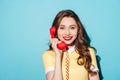 Smiling pretty woman in dress holding retro telephone tube Royalty Free Stock Photo