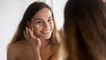 Smiling pretty woman grooming herself after showering. Royalty Free Stock Photo
