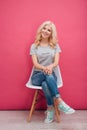 Smiling pretty woman sitting on the chair Royalty Free Stock Photo