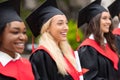 Pretty blonde lady standing among international group of students Royalty Free Stock Photo