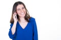 Smiling pretty young happy woman talking on cell smartphone phone Royalty Free Stock Photo