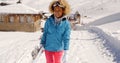 Smiling pretty young woman carrying a snowboard Royalty Free Stock Photo