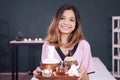 Smiling Professional Asian Thai Massage therapist woman is Ã Â¹â°holding a herbals tray for therapy at alternative medicine healing