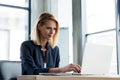 smiling professional businesswoman working with laptop