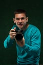 Smiling professional photographer with camera Royalty Free Stock Photo