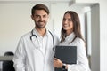 Smiling professionals male doctor and female nurse looking at camera Royalty Free Stock Photo