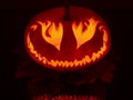 Smiling pumpkin with eyes like fire flames at halloween Royalty Free Stock Photo