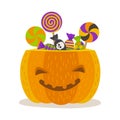 Smiling Pumpkin with Halloween Candy and Lollipops. Royalty Free Stock Photo