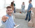 Smiling realtor with clipboard showing keys to new apartment Royalty Free Stock Photo