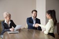 Smiling recruiter handshaking successful job applicant at interv Royalty Free Stock Photo