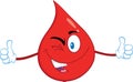 Smiling Red Blood Drop Cartoon Mascot Character Giving A Double Thumbs Up Royalty Free Stock Photo