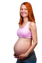 Smiling red hair pregnant woman, isolated on white background.