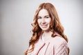 Smiling redhead girl in pink jacket Royalty Free Stock Photo