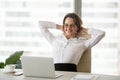 Smiling relaxed businesswoman watching funny online video at wor Royalty Free Stock Photo