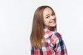 Smiling relaxed teen girl looking at camera over shoulder Royalty Free Stock Photo