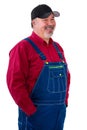 Smiling relaxed worker or farmer in overalls Royalty Free Stock Photo