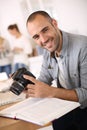 Smiling reporter working at office Royalty Free Stock Photo