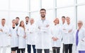 Smiling research supervisor standing in front of his team.