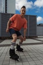 Smiling roller skater in casual clothes