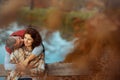 smiling romantic couple in park kissing while sitting on bench Royalty Free Stock Photo