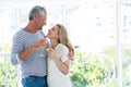 Smiling romantic mature couple with wine glasses Royalty Free Stock Photo