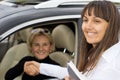 Smiling saleslady congratulating the new owner Royalty Free Stock Photo