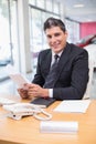 Smiling salesperson holding a document