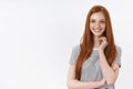 Smiling sassy good-looking ginger european young 20s girl student amused entertained touch neck looking intrigued gazing