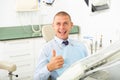 Smiling satisfied man patient visiting dentist Royalty Free Stock Photo