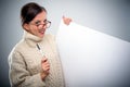 Smiling scholarly young woman with a sign Royalty Free Stock Photo