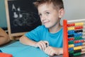 Smiling school boy working on math homework Royalty Free Stock Photo