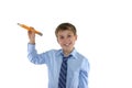 Smiling schoolboy holding a pencil