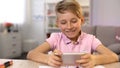 Smiling schoolboy playing smartphone, gadget addiction, procrastination problem