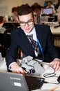 Smiling schoolboy programming the robot at robotics competitions.