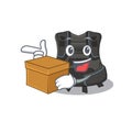 A smiling scuba buoyancy compensator cartoon mascot style having a box Royalty Free Stock Photo