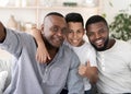 Smiling Senior Black Man Taking Selfie With Son And Grandson At Home Royalty Free Stock Photo