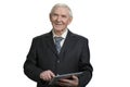 Smiling senior business man tapping tablet. Royalty Free Stock Photo