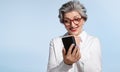 Smiling senior businesswoman with phone Royalty Free Stock Photo