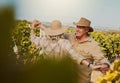 Smiling senior couple dancing together and feeling playful on vineyard. Caucasian husband and wife standing together and Royalty Free Stock Photo