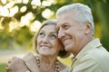 Smiling senior couple embracing in autumn park Royalty Free Stock Photo