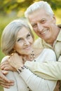 Smiling senior couple embracing in autumn park Royalty Free Stock Photo