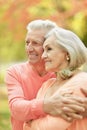 Smiling senior couple embracing in autumn park Royalty Free Stock Photo