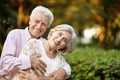 Smiling senior couple embracing in autumn park Royalty Free Stock Photo